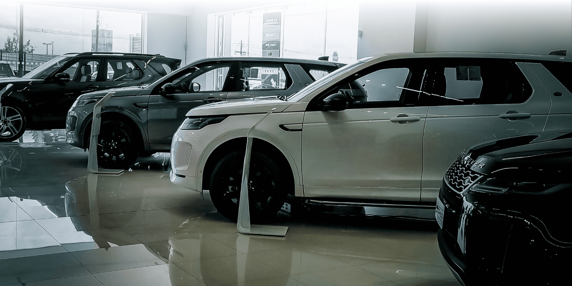Line of Land Rover cars in a dealership