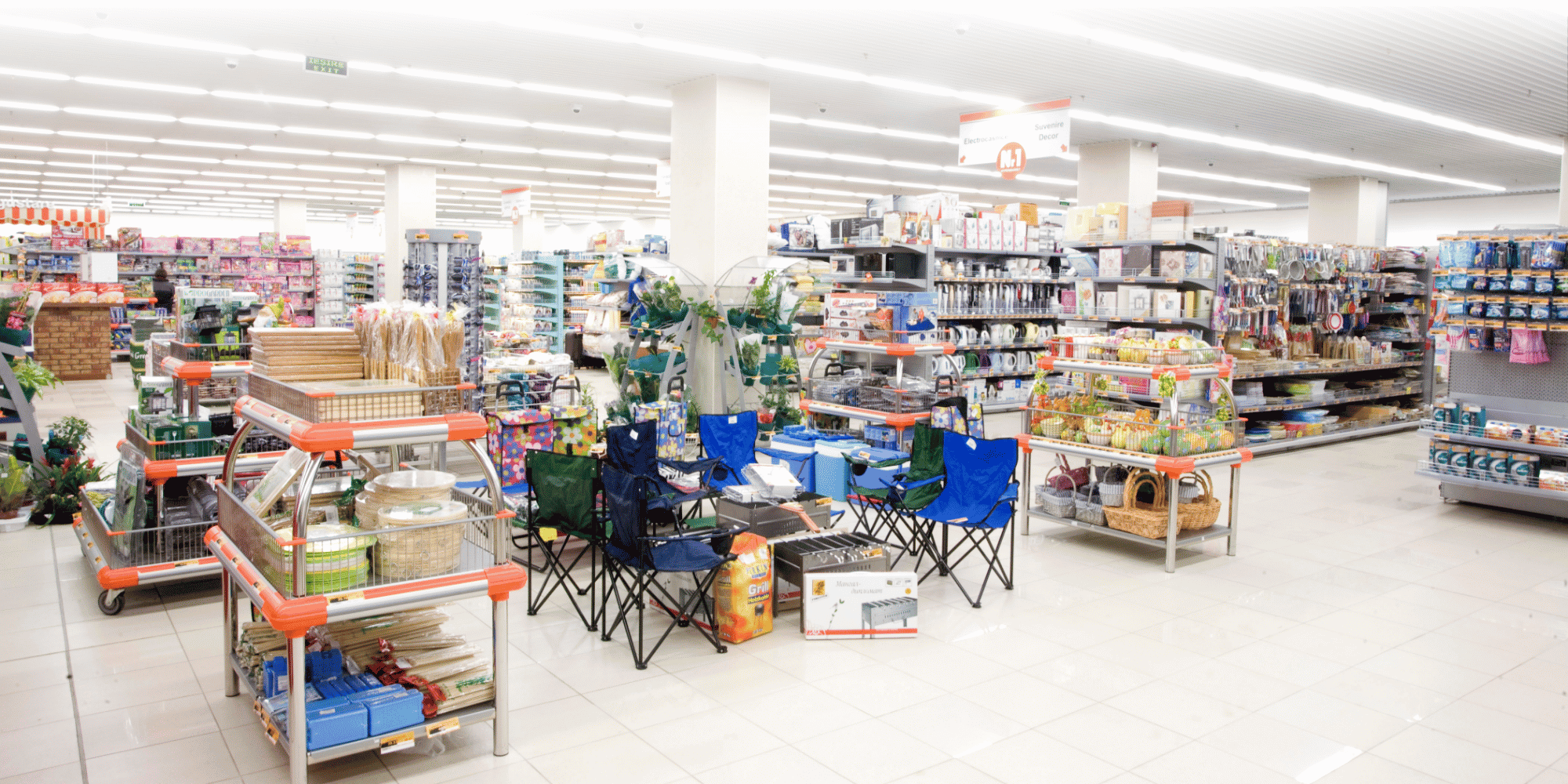Large retail store with different items such as chairs, cooking appliances and outdoor living