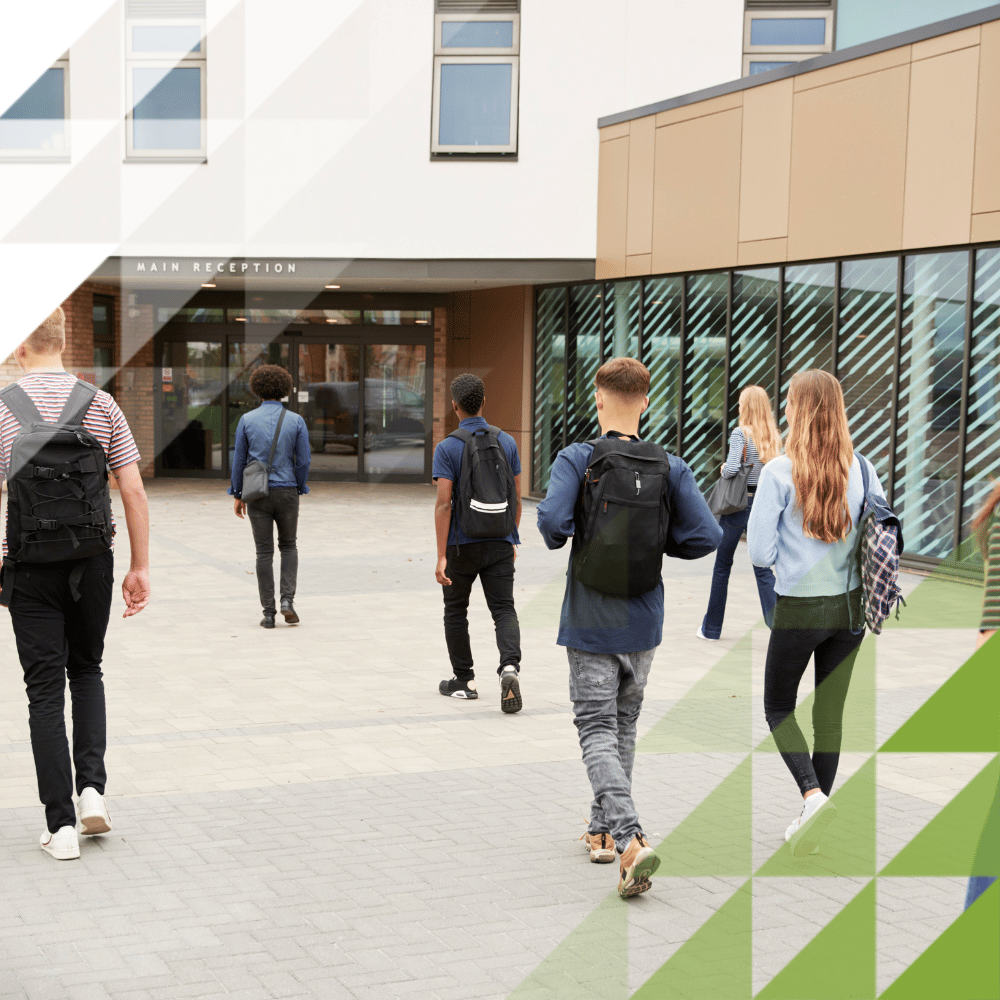group of students walking into an education facility or college