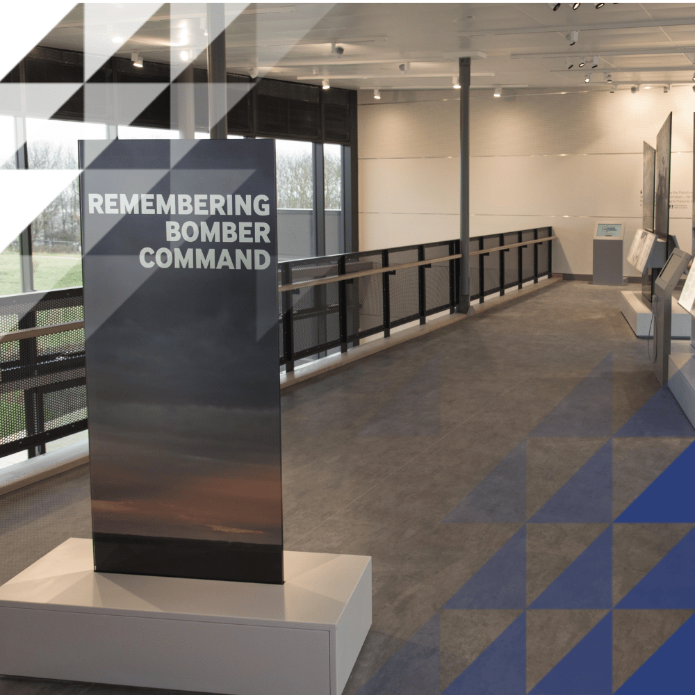 Interior of the command centre with a sign saying 'remebering bomber command' by glass windows