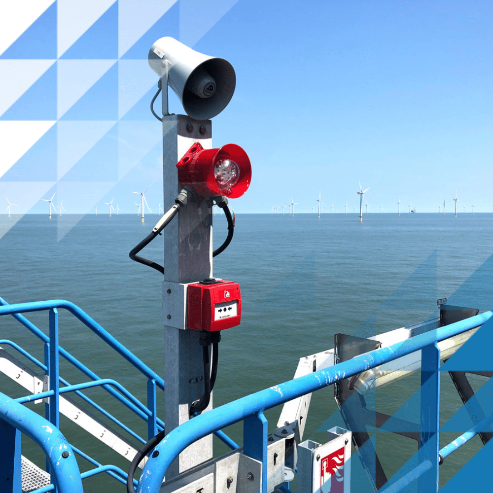 Large pole with waterproof beacons and call points - in the background is the ocean so the products are placed onto the metal of a wind farm.