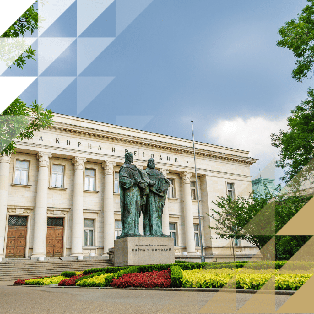 Neoclassical facade of the SS. Cyril and Methodius National Library in Sofia, Bulgaria, with columned entrance, a bronze statue of the brothers Cyril and Methodius out front, and a landscaped garden.