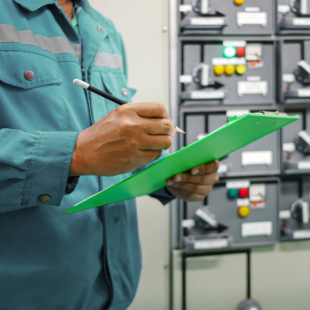 Man in jacket using clipboard